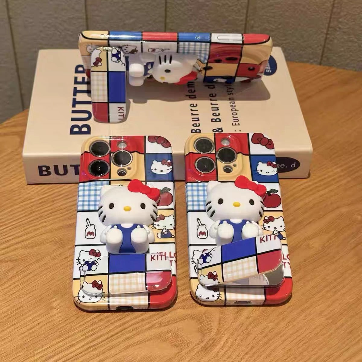 Hello Kitty mirror phone case with a stand and grid pattern