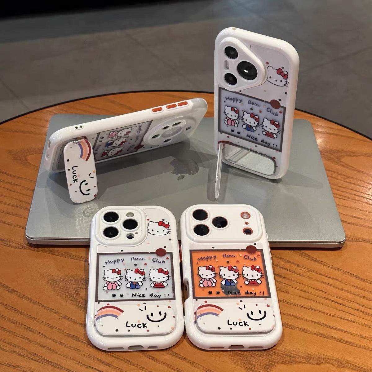 Three Kitty phone cases with mirror stands