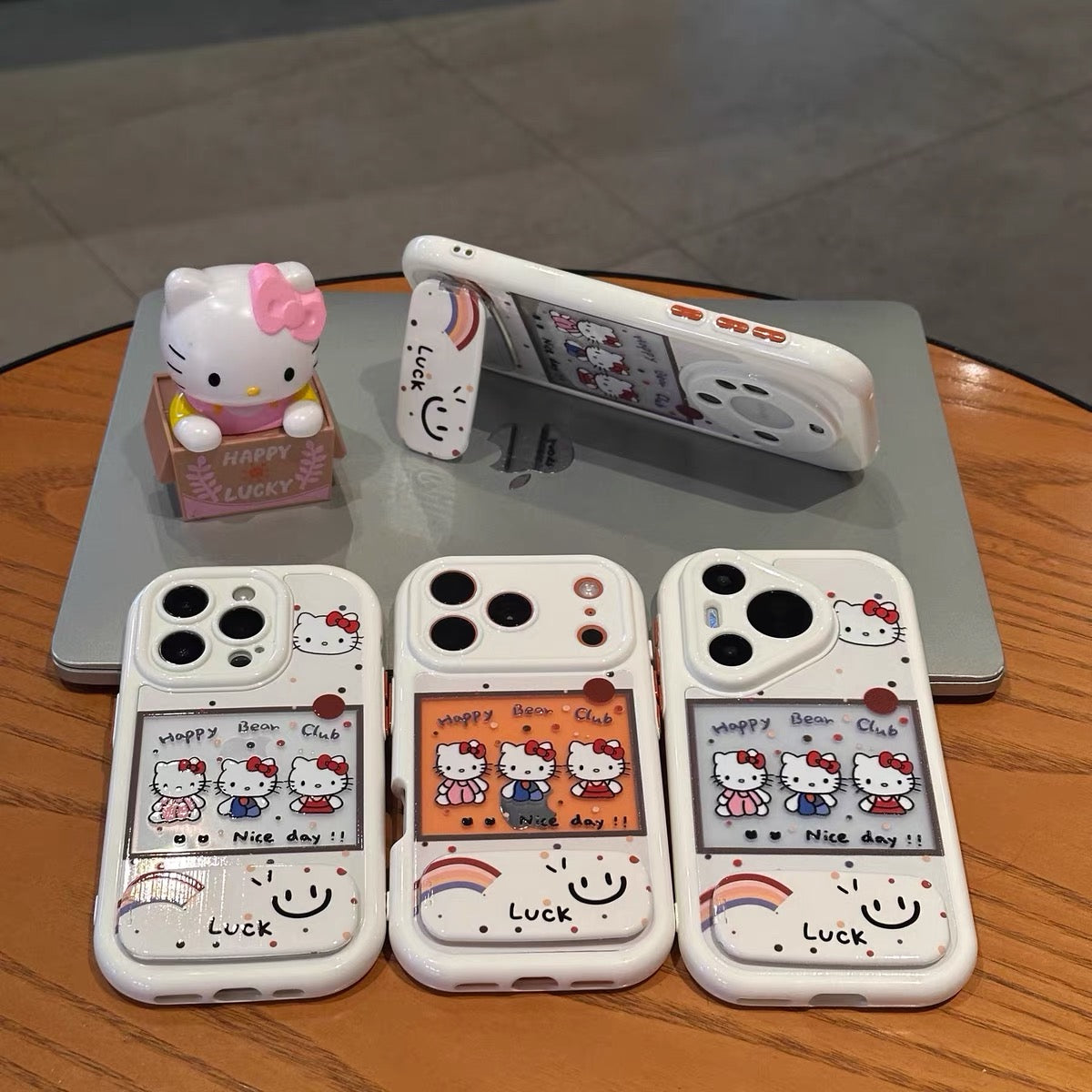 Three Kitty phone cases with mirror stands