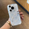 Blue and white floral phone case with a stand
