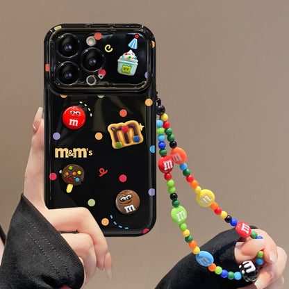 Polka-dot M&M character phone case with a flip-out mirror and wrist strap.