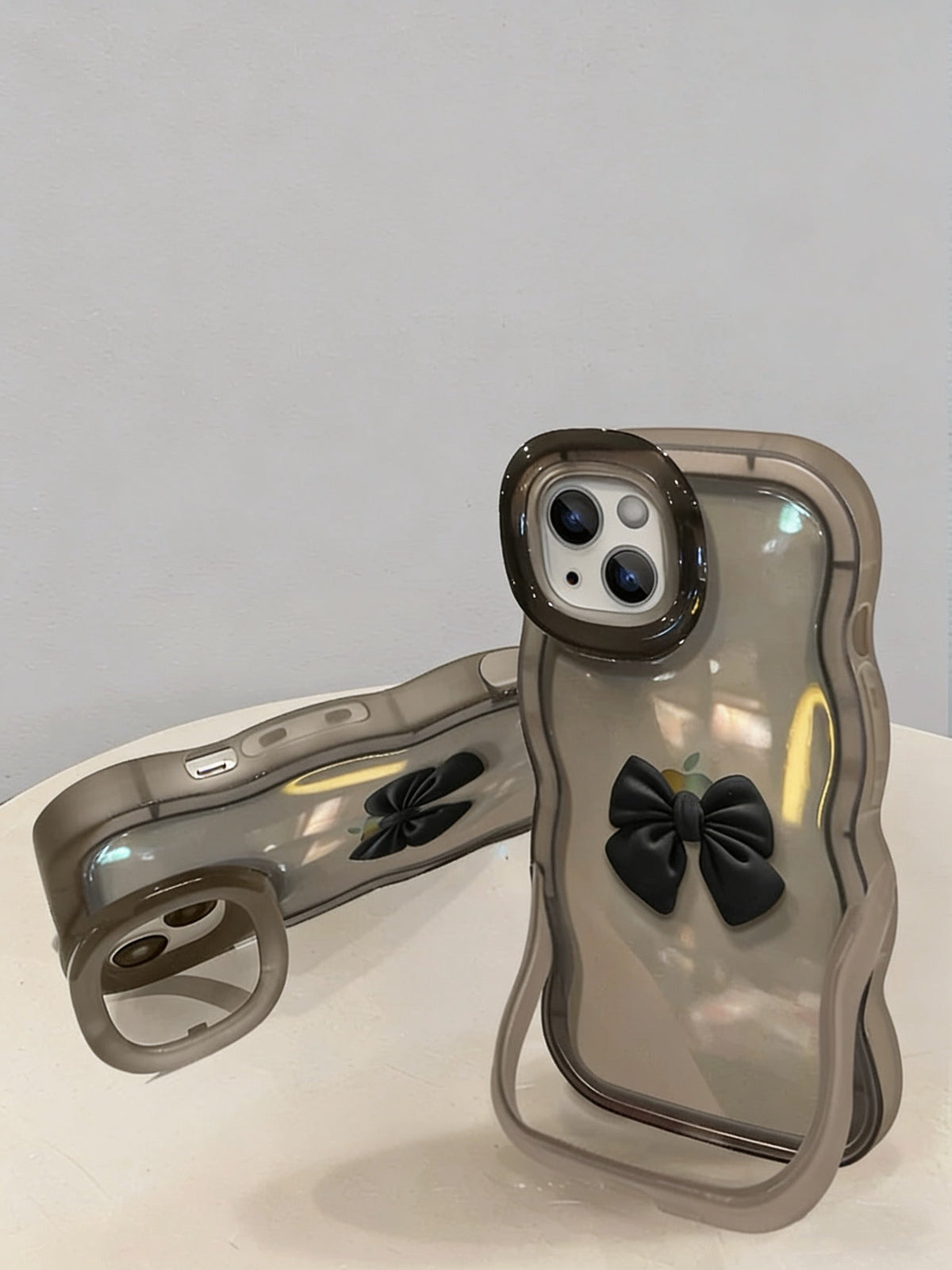 Bow-shaped invisible double stand phone case