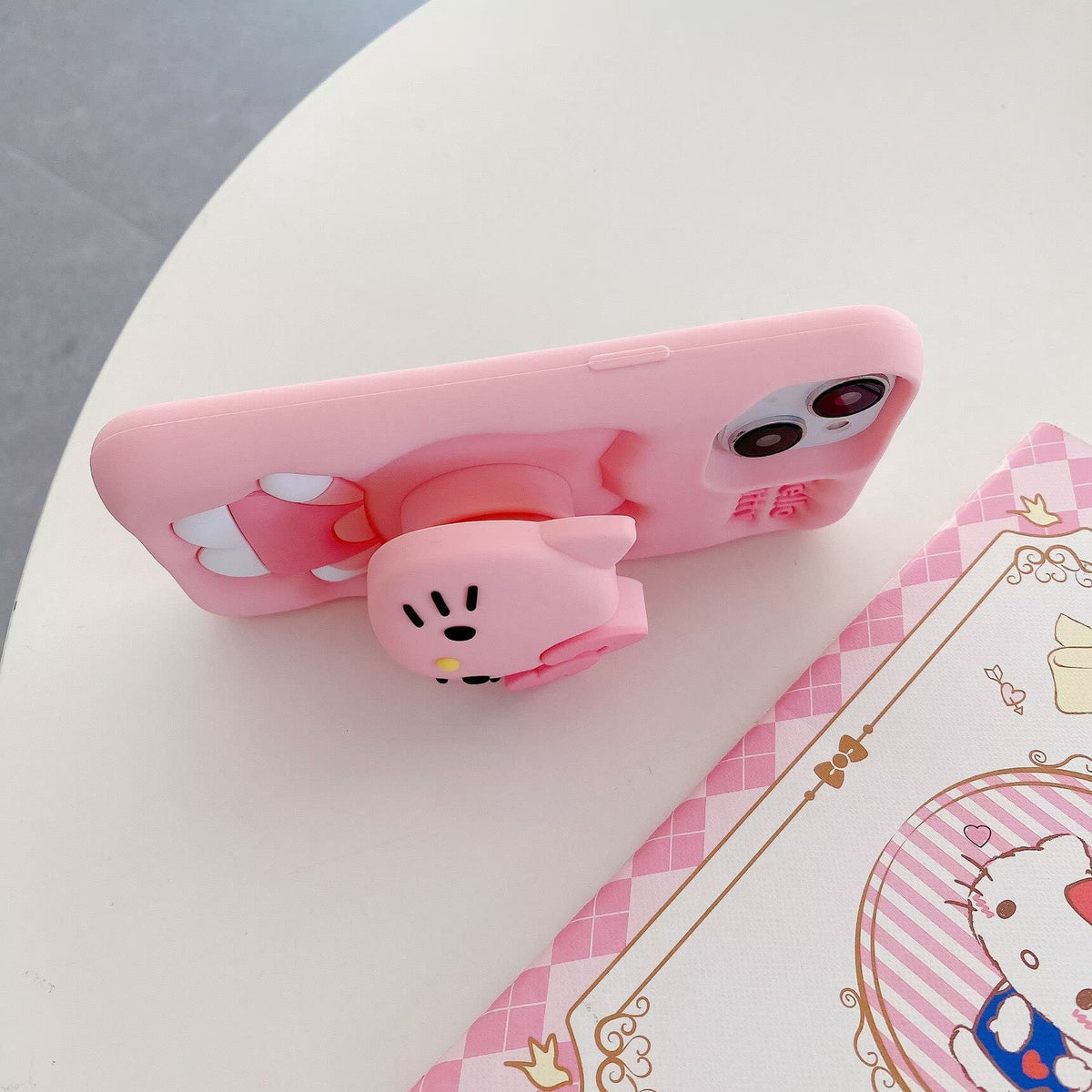 Pink Hello Kitty phone case with stand